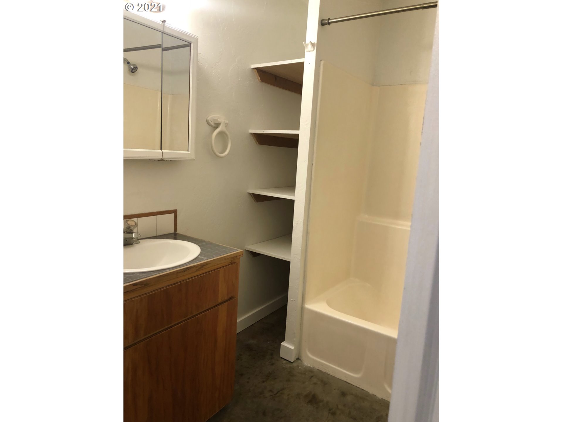 623 Southwest 4th Street Pendleton, OR 97801 - Photo 7 of 32 a bathroom with a sink a toilet and shower