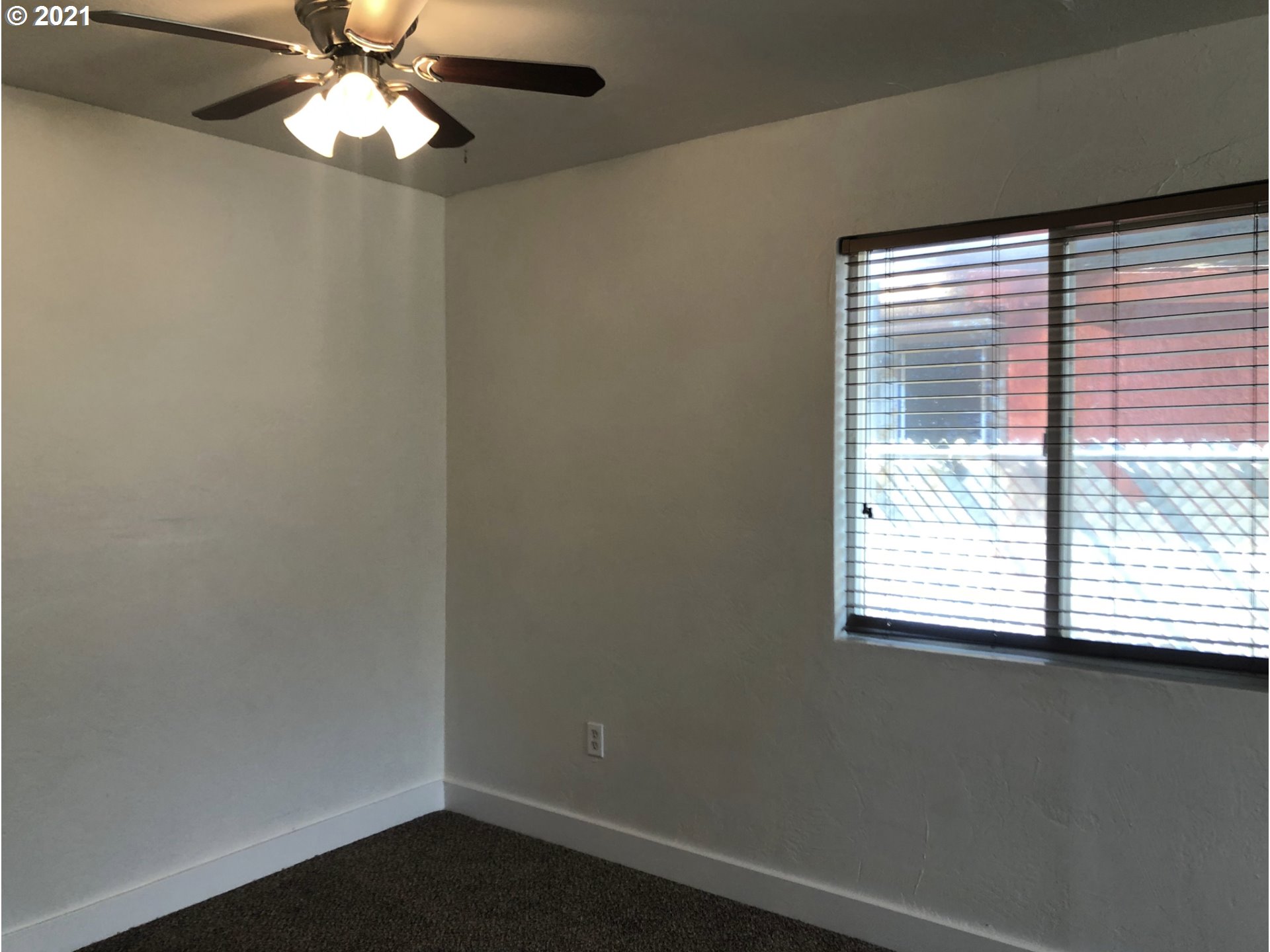 623 Southwest 4th Street Pendleton, OR 97801 - Photo 10 of 32 a view of a small space with wooden floor and a window