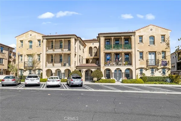 a view of a big building next to a road