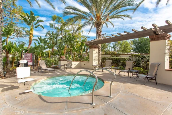a swimming pool with outdoor seating and yard
