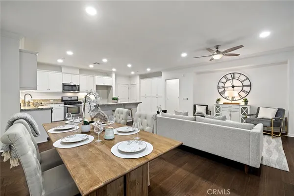a large kitchen with a table and chairs