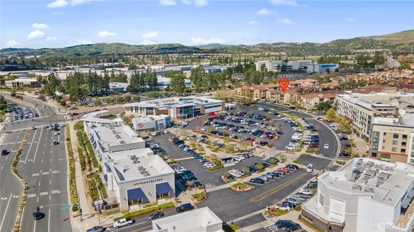 an aerial view of residential houses with street