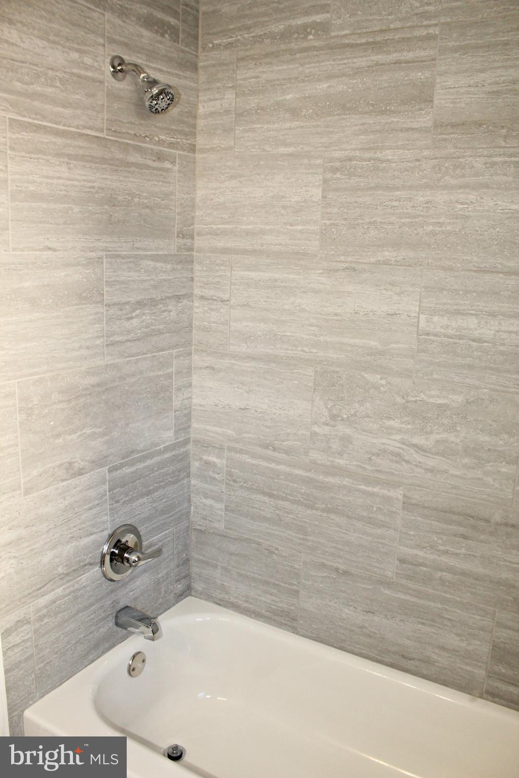 1723 Leslie Road Baltimore, MD 21222 - Photo 18 of 23 New hall bathroom with tile!
