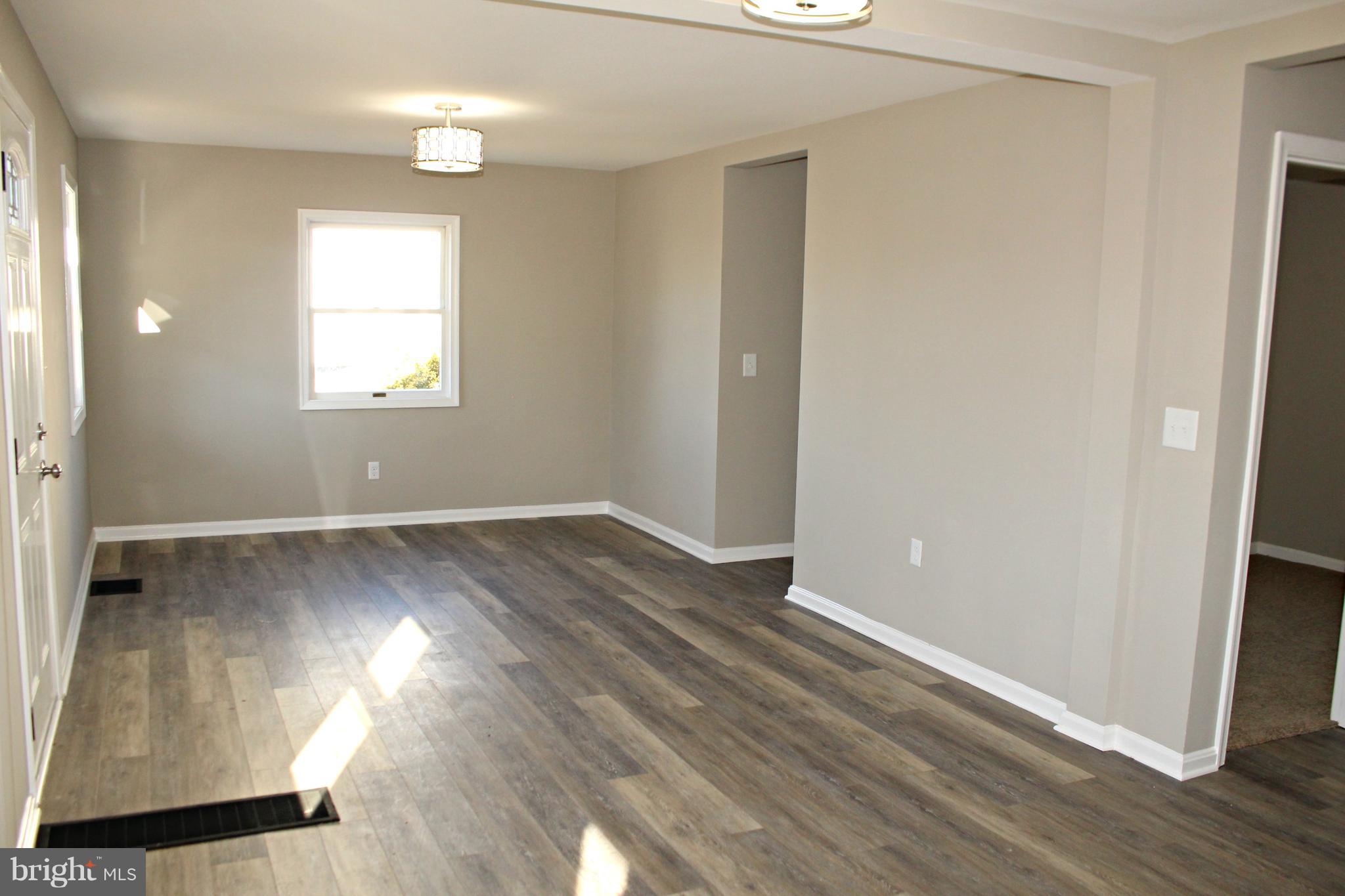 1723 Leslie Road Baltimore, MD 21222 - Photo 4 of 23 New luxury vinyl plank flooring and new paint!