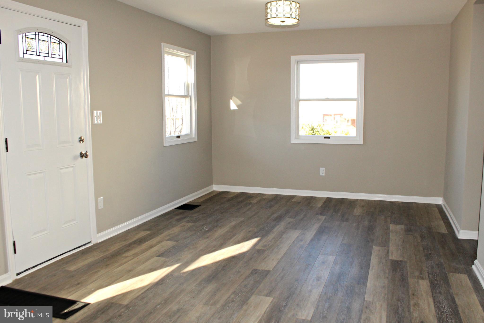 1723 Leslie Road Baltimore, MD 21222 - Photo 8 of 23 New luxury vinyl plank flooring and new paint!