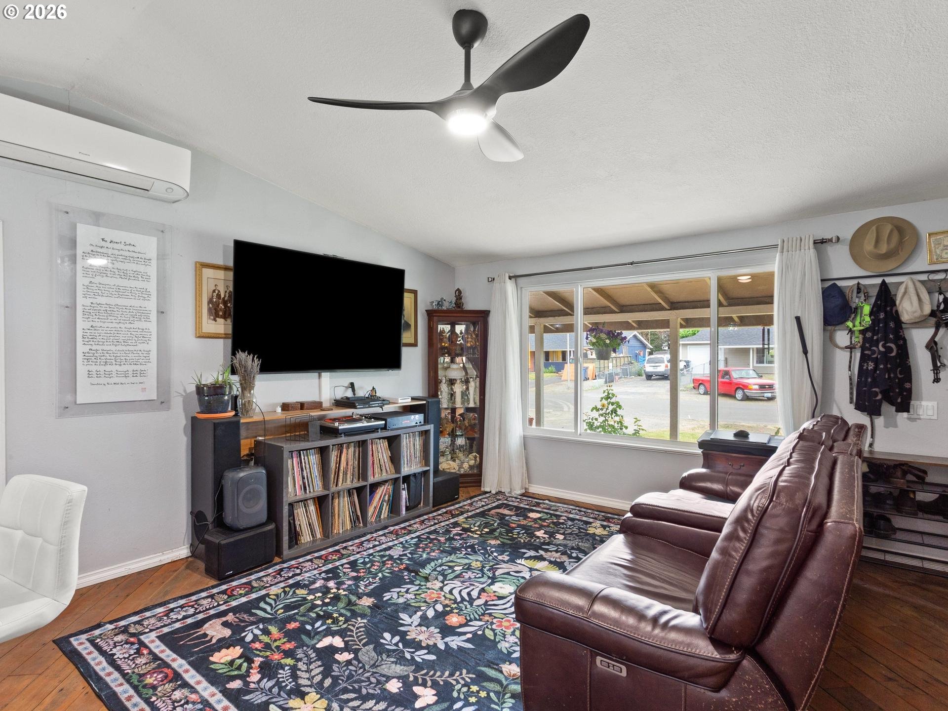 1719 Southwest 1st Street Battle Ground, WA 98604 - Photo 10 of 37 a living room with furniture and a flat screen tv