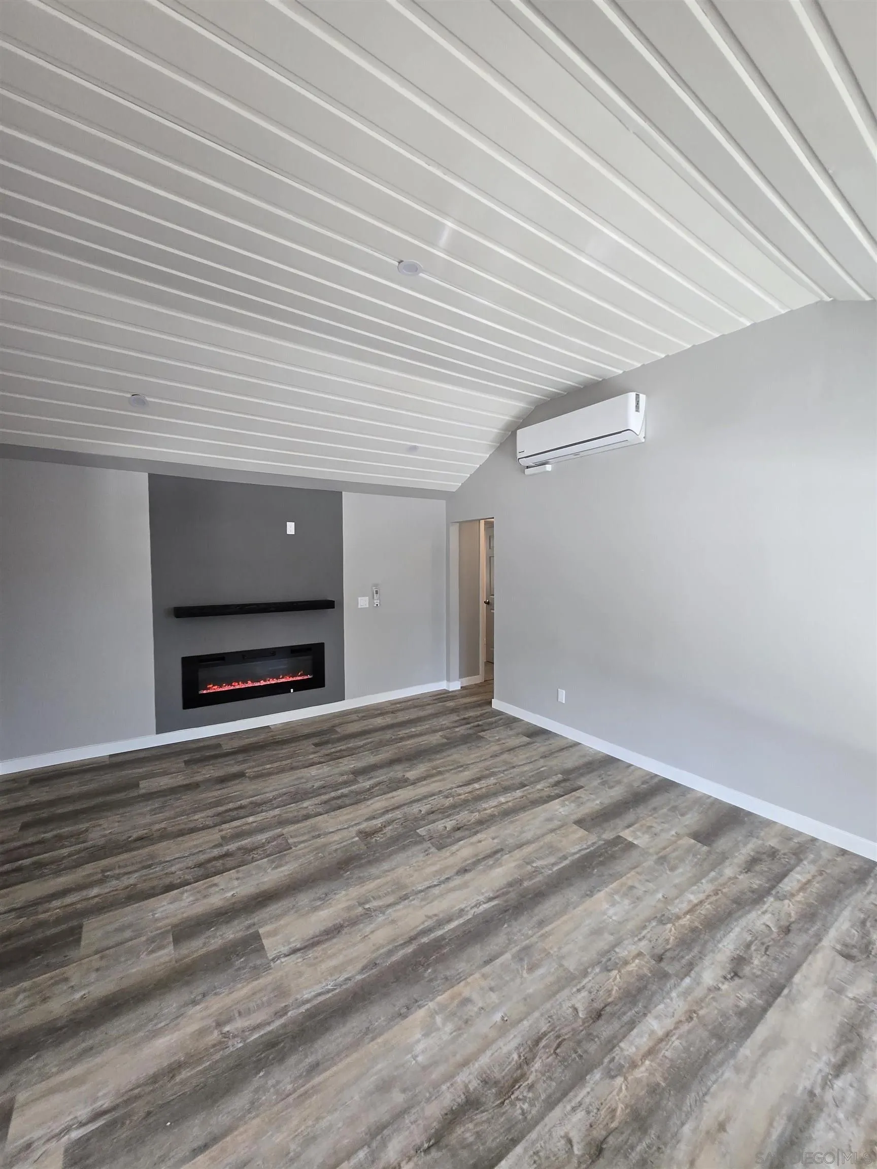 940 South Upas Street Escondido, CA 92025 - Photo 13 of 55 a view of empty room with wooden floor