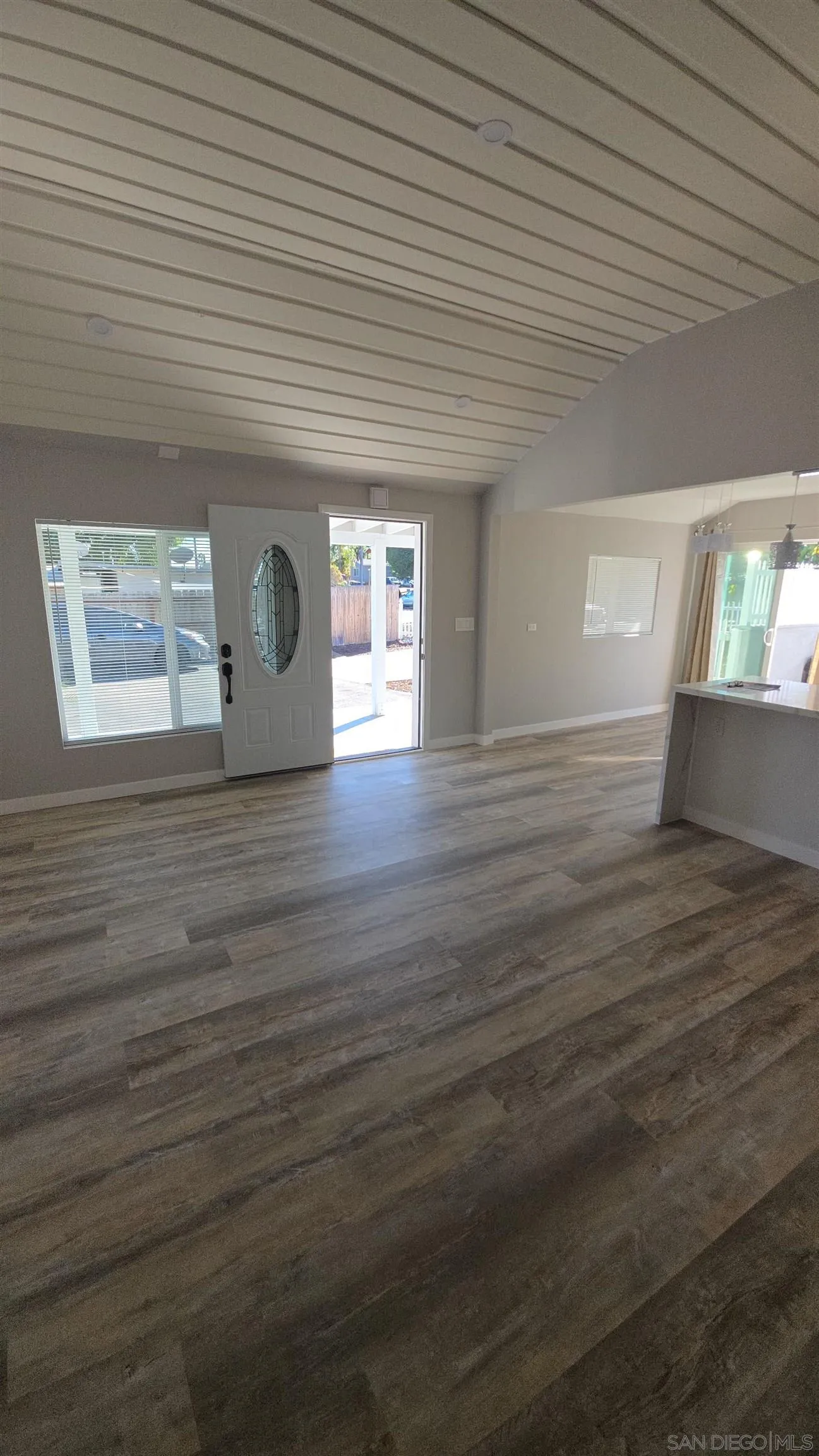 940 South Upas Street Escondido, CA 92025 - Photo 16 of 55 an empty room with wooden floor and windows
