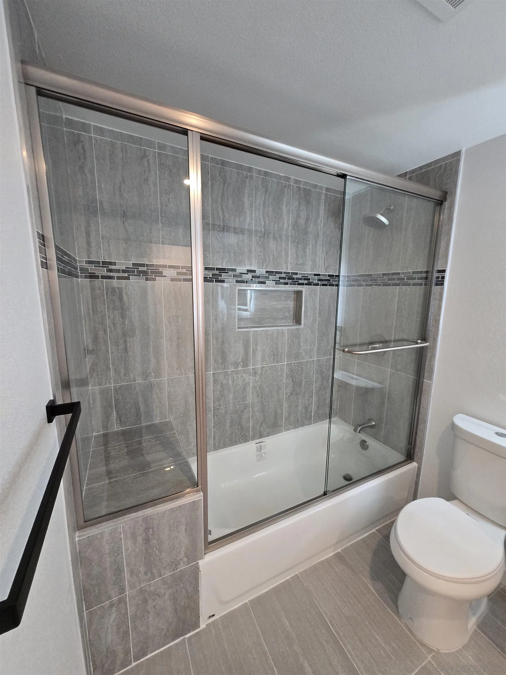 940 South Upas Street Escondido, CA 92025 - Photo 23 of 55 a bathroom with a shower and a toilet