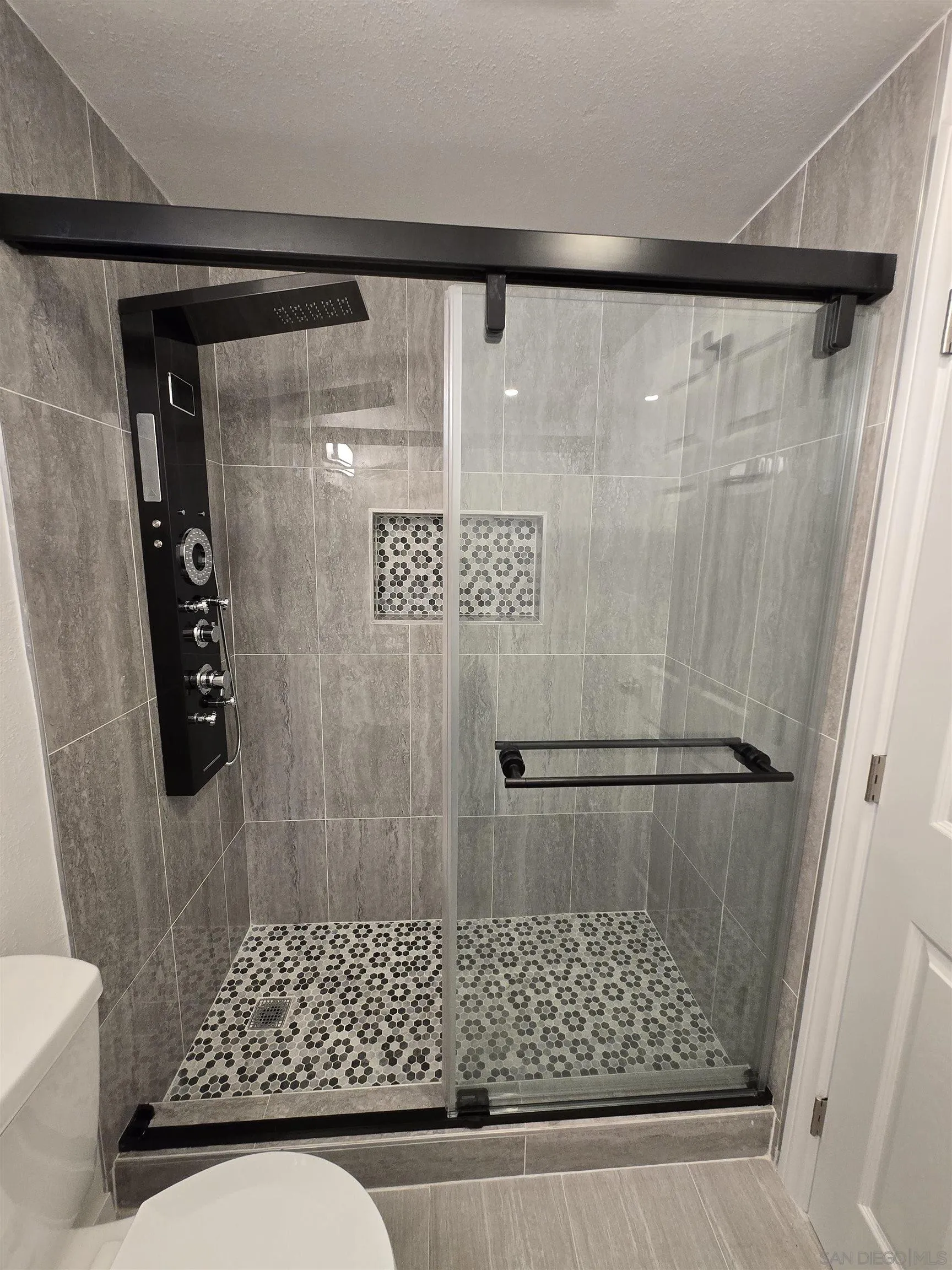 940 South Upas Street Escondido, CA 92025 - Photo 26 of 55 a bathroom with a shower