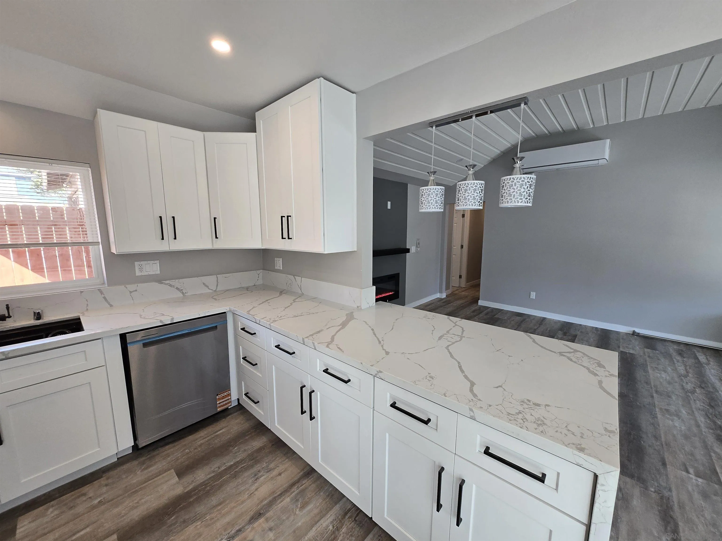 940 South Upas Street Escondido, CA 92025 - Photo 29 of 55 a kitchen with granite countertop white cabinets and white appliances