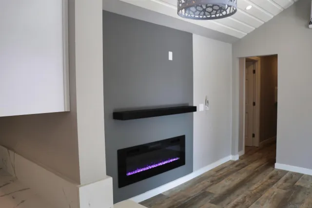 a kitchen with a refrigerator sink and cabinets