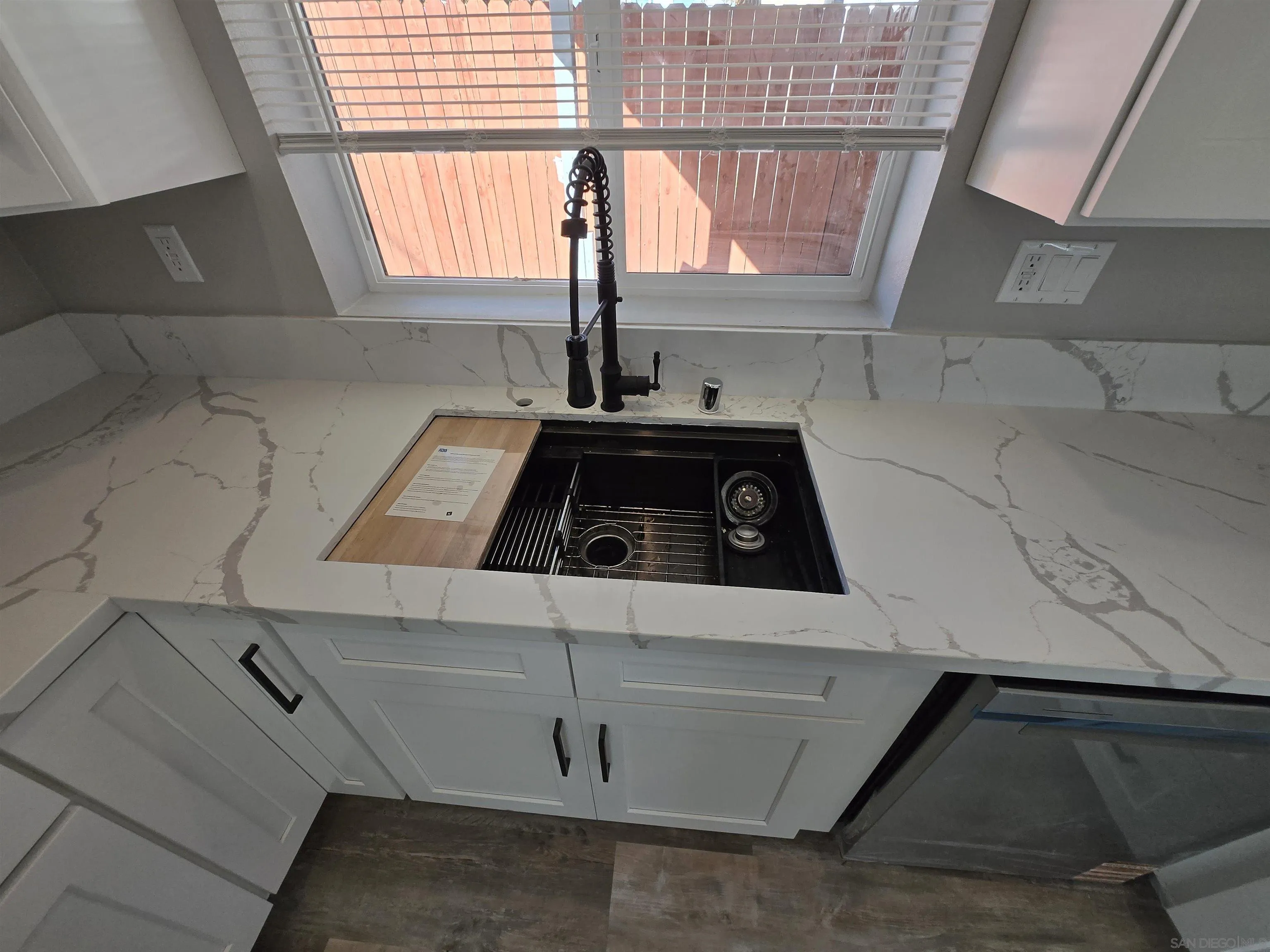 940 South Upas Street Escondido, CA 92025 - Photo 31 of 55 a kitchen with a white cabinets and a stove top oven