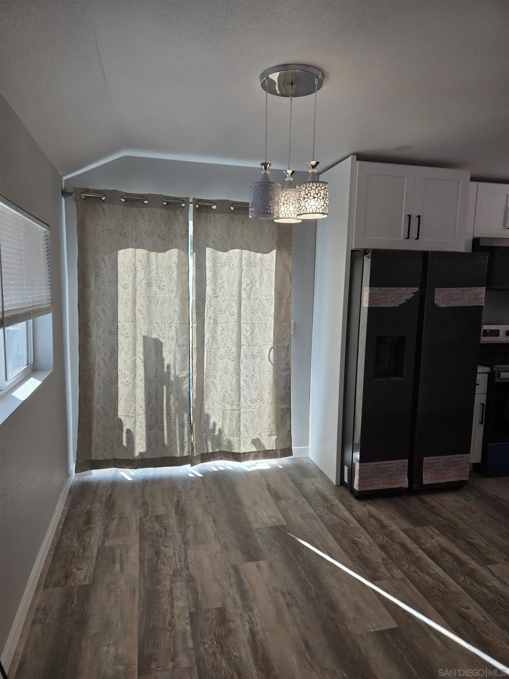 940 South Upas Street Escondido, CA 92025 - Photo 32 of 55 a view of a room with wooden floor and chandelier