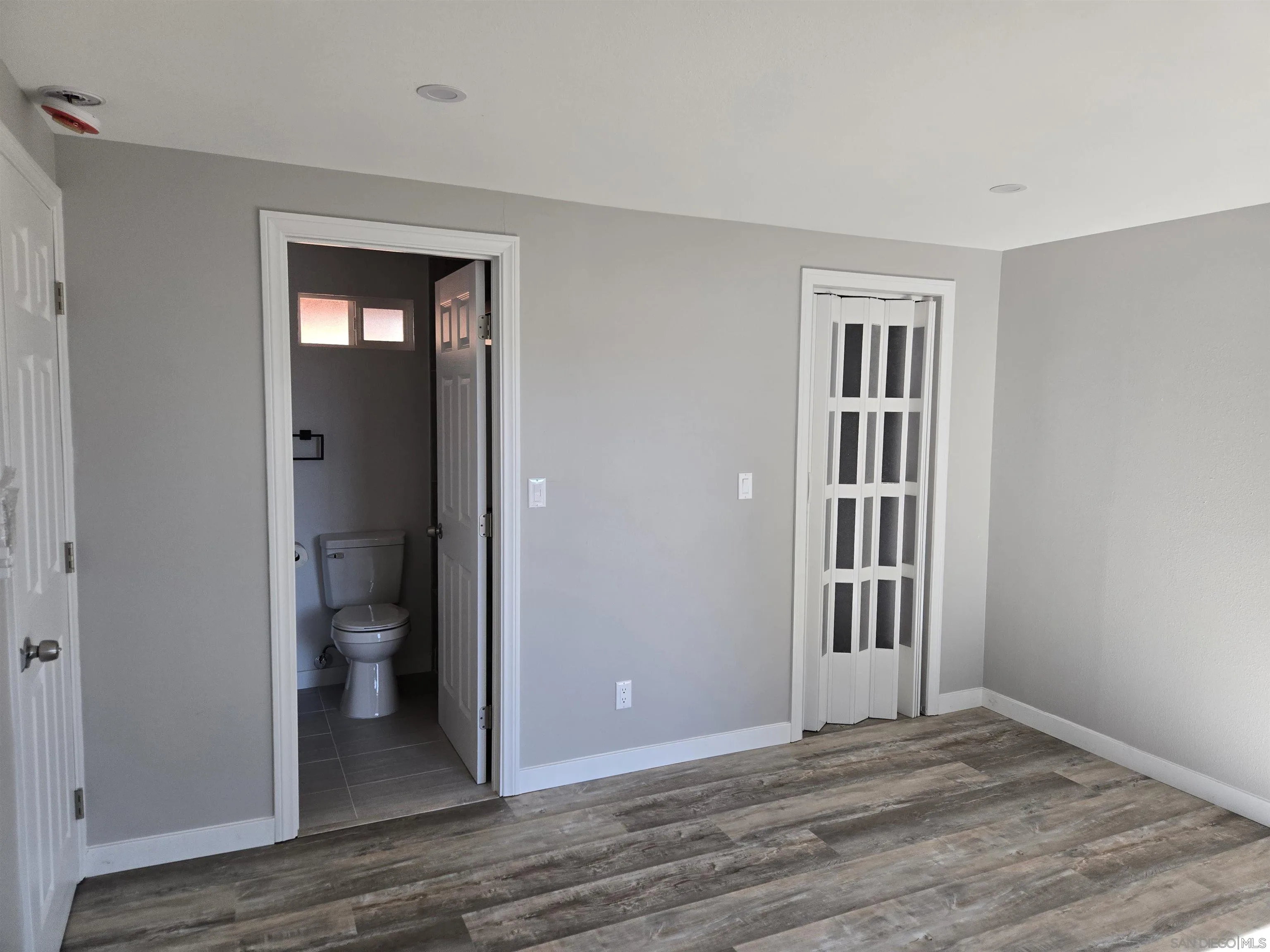 940 South Upas Street Escondido, CA 92025 - Photo 35 of 55 a view of a room with wooden floor and a bathroom