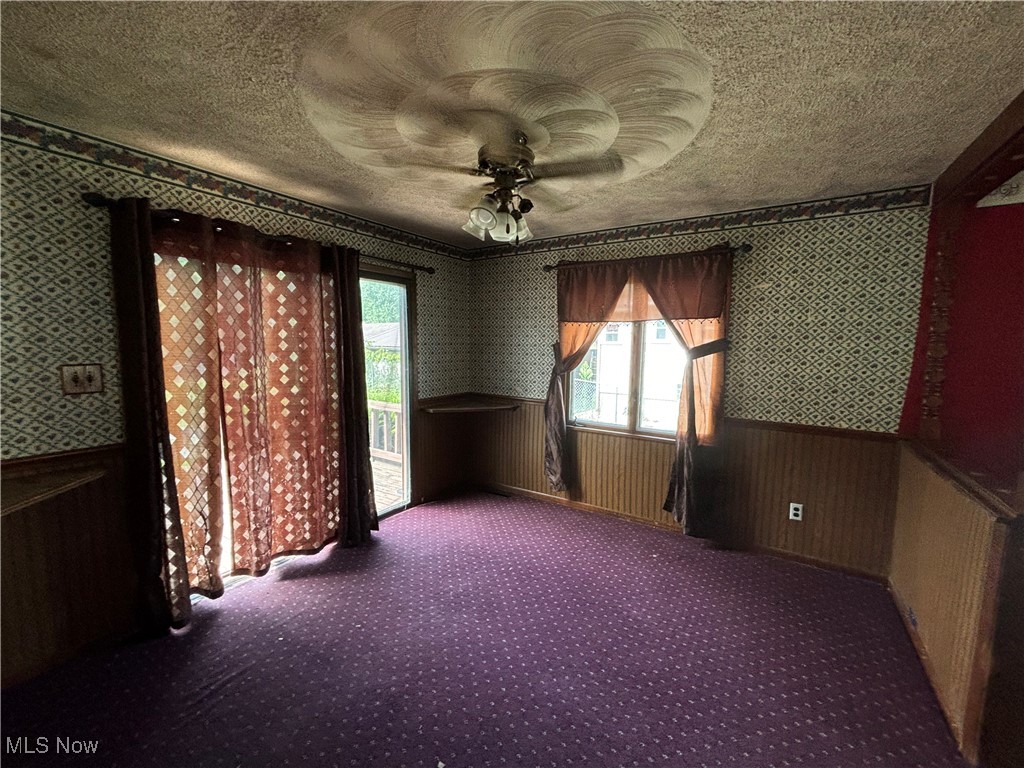 5164 Rutledge Street Southeast Dennison, OH 44621 - Photo 11 of 14 Unfurnished room with carpet flooring and ceiling fan