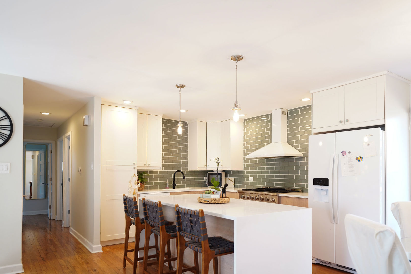 21W272 Coronet Road Lombard, IL 60148 - Photo 11 of 31 a kitchen with stainless steel appliances kitchen island granite countertop a refrigerator a stove and white cabinets with wooden floor