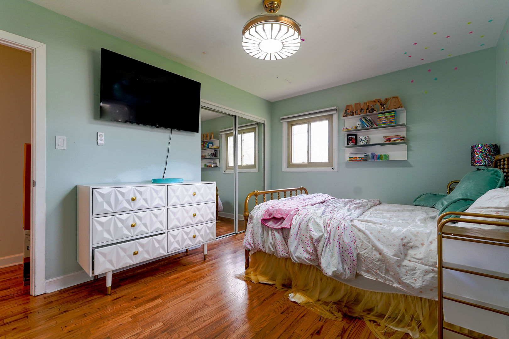 21W272 Coronet Road Lombard, IL 60148 - Photo 13 of 31 a bedroom with a bed and a flat tv screen on the dresser