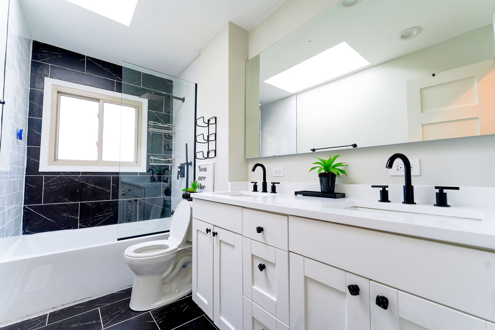 21W272 Coronet Road Lombard, IL 60148 - Photo 16 of 31 a bathroom with a sink a toilet and shower