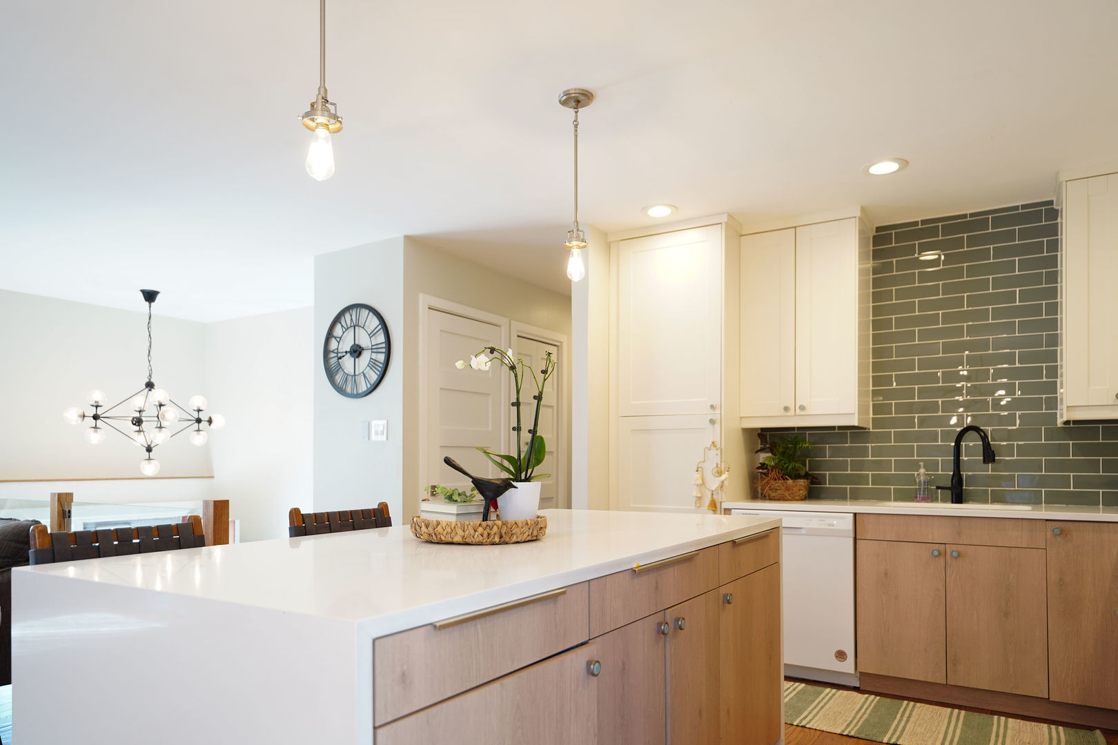 21W272 Coronet Road Lombard, IL 60148 - Photo 9 of 31 a kitchen with a sink and a clock on the wall