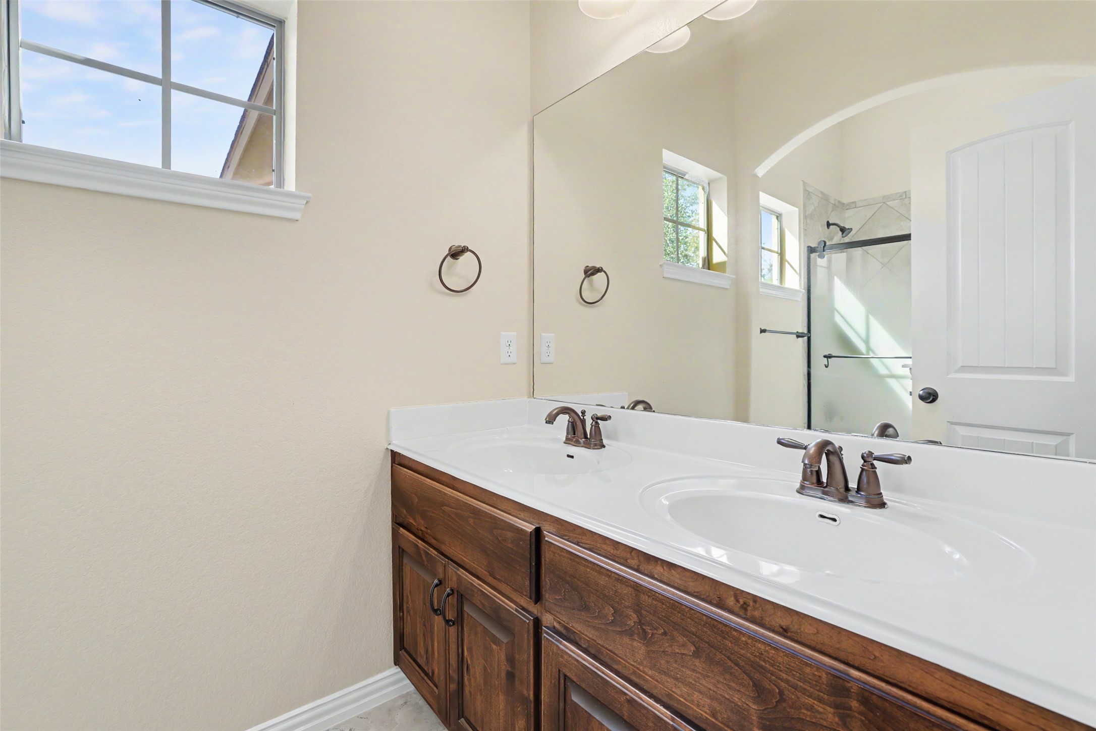 1020 Winding Way Drive Georgetown, TX 78628 - Photo 22 of 32 Bathroom featuring double vanity and an enclosed shower