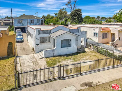 a view of a house with a small yard