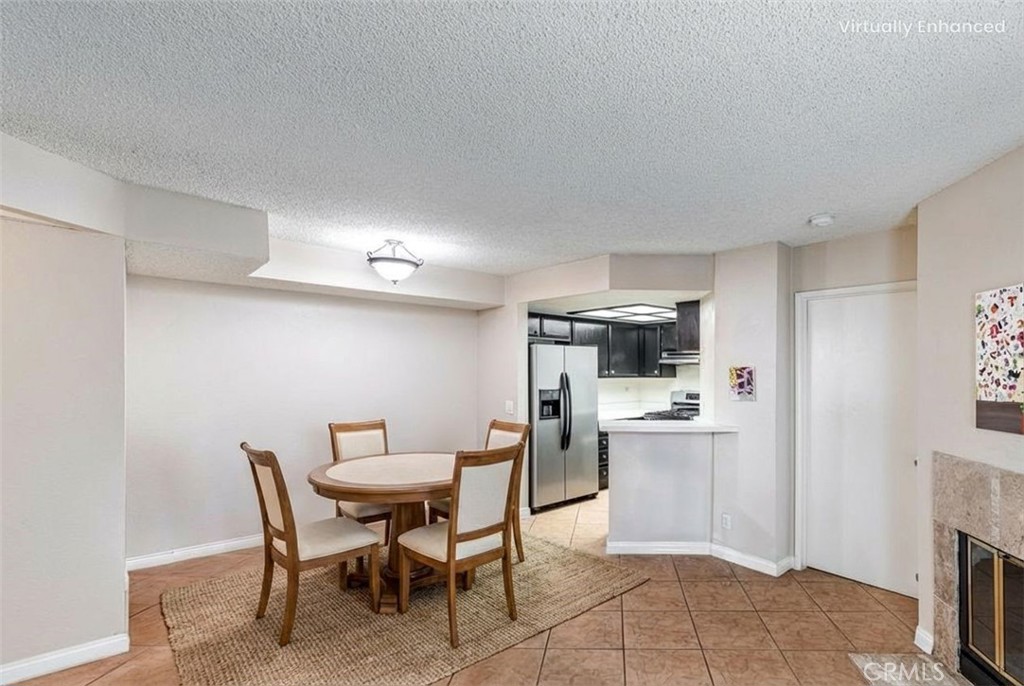 14610 Erwin Street, Unit 212 Van Nuys, CA 91411 - Photo 6 of 12 Virtually staged dining room