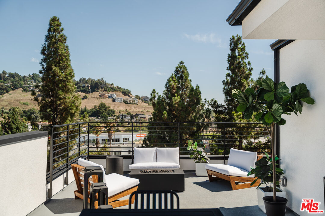 3872 North Riley Lane Los Angeles, CA 90065 - Photo 15 of 30 a view of a terrace with couches and potted plants
