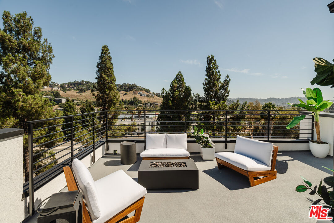 3872 North Riley Lane Los Angeles, CA 90065 - Photo 18 of 30 a roof deck with couches and potted plants