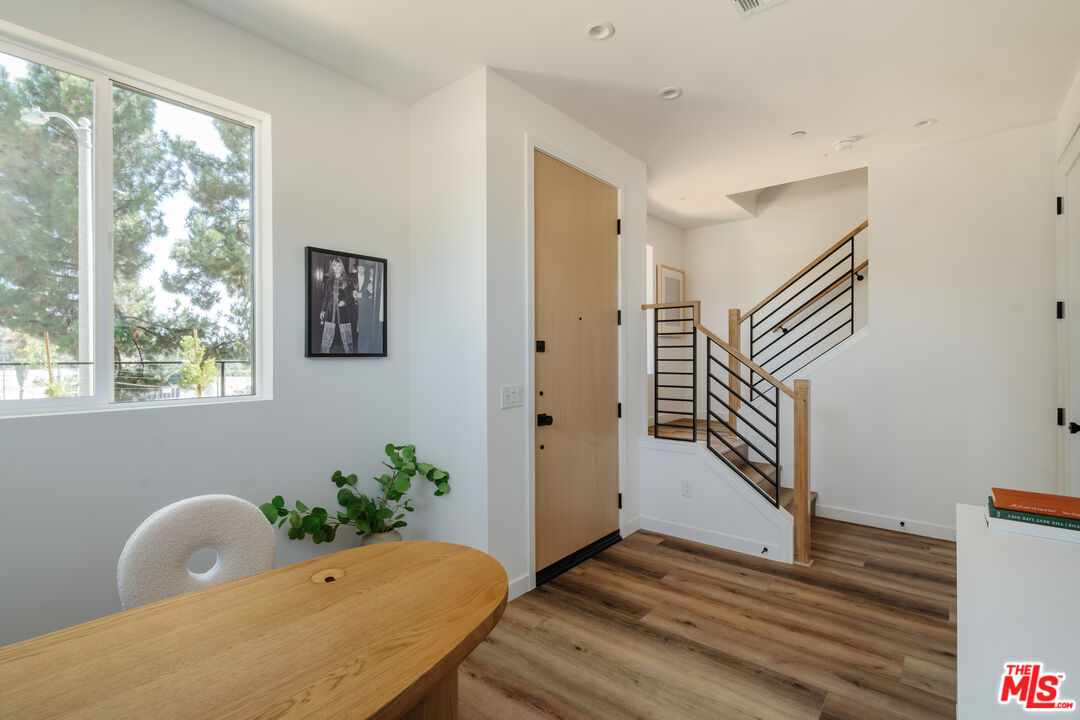 3872 North Riley Lane Los Angeles, CA 90065 - Photo 20 of 30 a view of a hallway with wooden floor and a potted plant