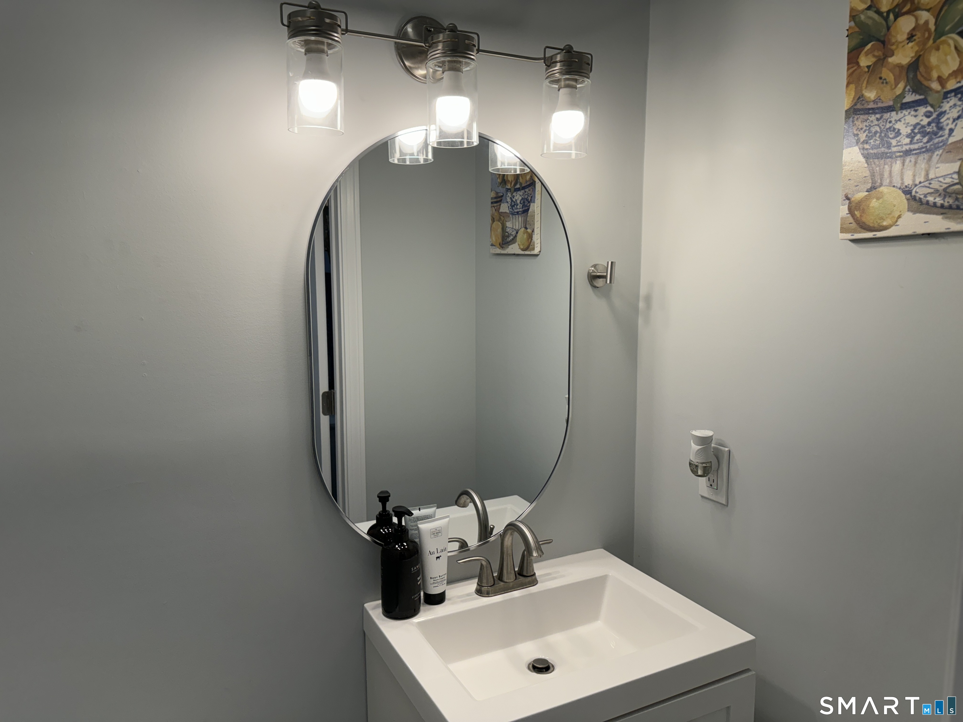 7 Pootatuck Park Road Newtown, CT 06482 - Photo 9 of 25 a bathroom with a sink and a mirror