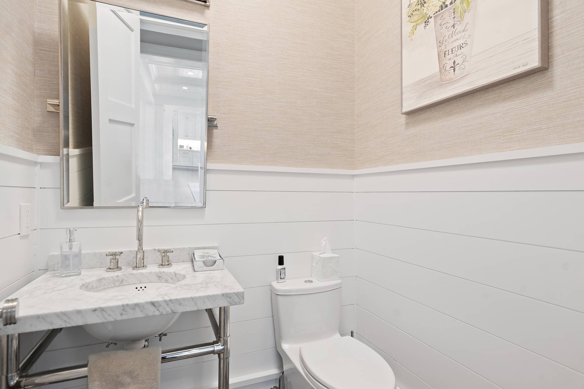 135 Hildreth Lane Bridgehampton, NY 11932 - Photo 12 of 38 a bathroom with a toilet a sink and mirror