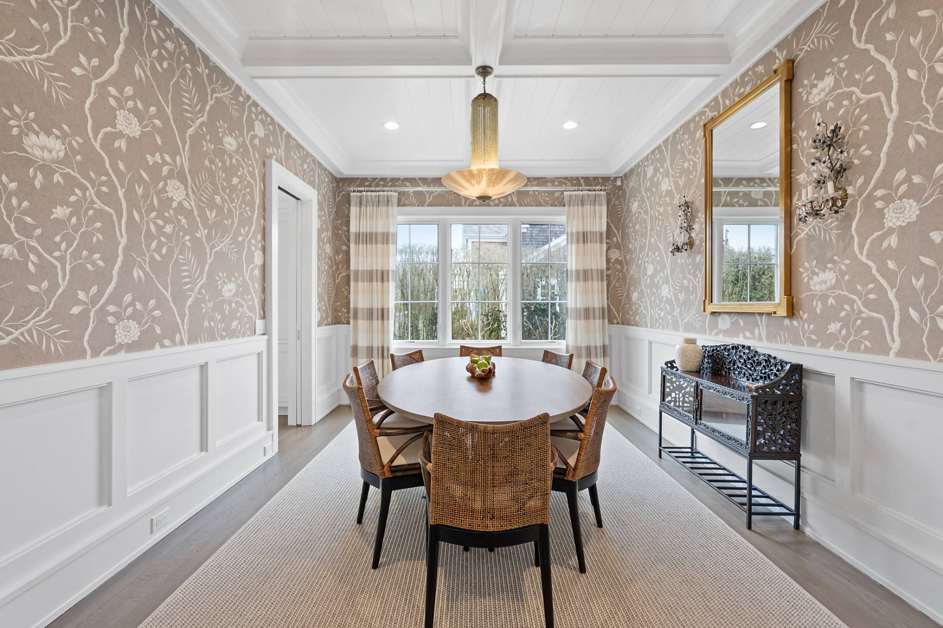 135 Hildreth Lane Bridgehampton, NY 11932 - Photo 13 of 38 a dining room with furniture a chandelier and wooden floor