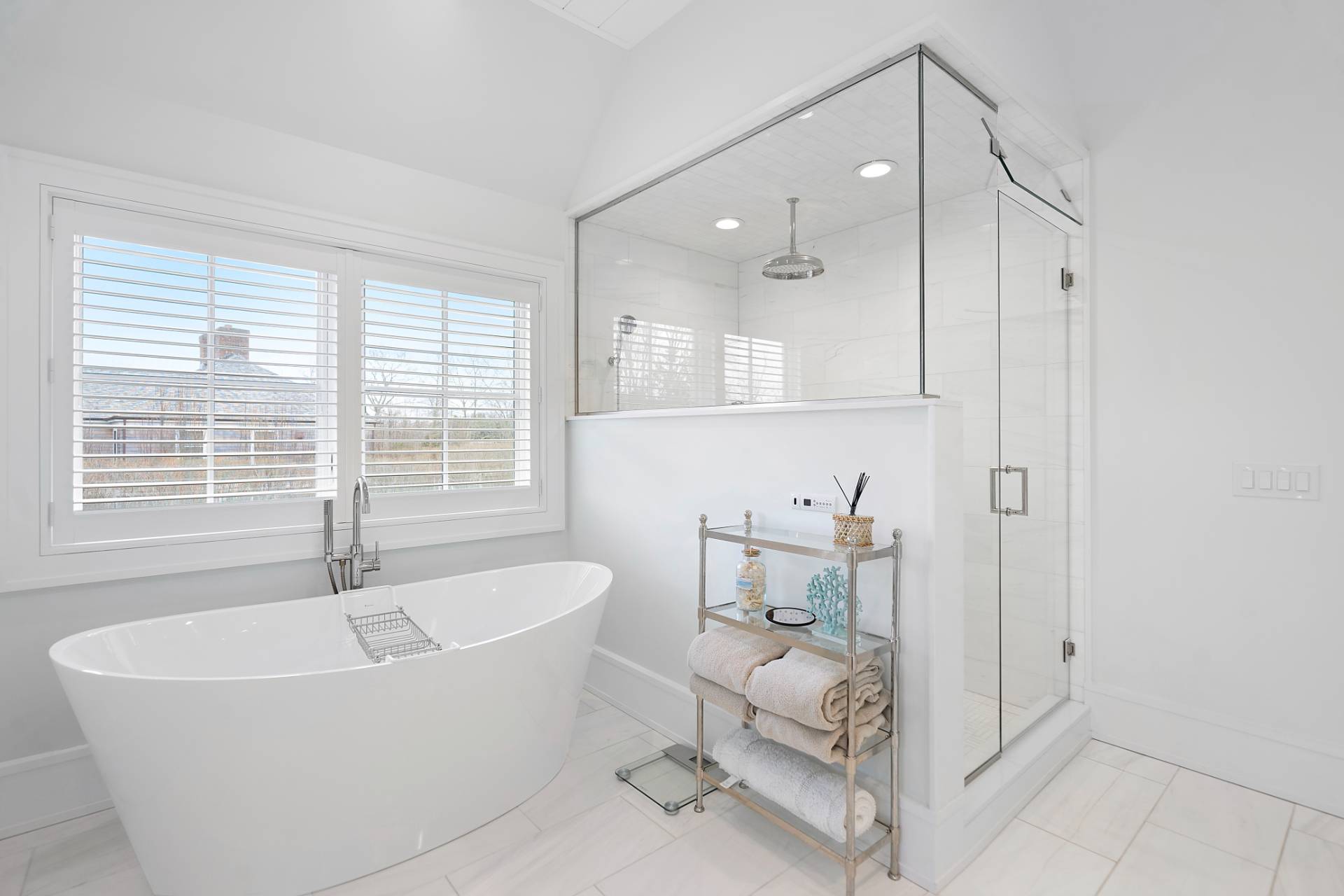 135 Hildreth Lane Bridgehampton, NY 11932 - Photo 18 of 38 a white bath tub sitting in a bathroom and mirror