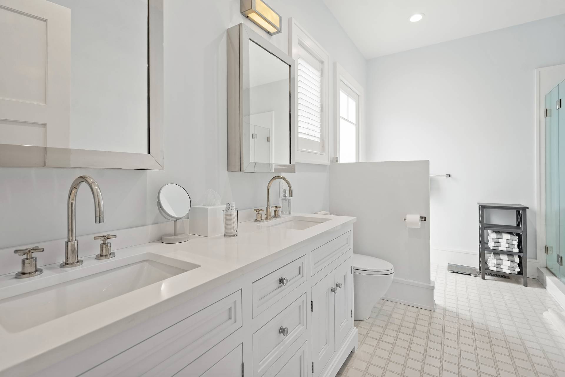 135 Hildreth Lane Bridgehampton, NY 11932 - Photo 22 of 38 a bathroom with double vanity sink a mirror and a toilet