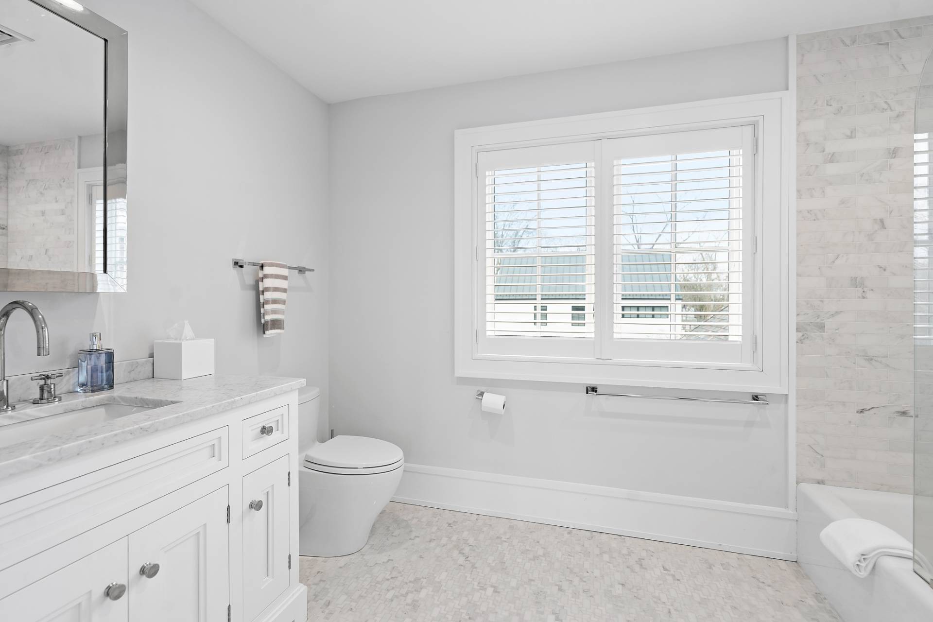135 Hildreth Lane Bridgehampton, NY 11932 - Photo 28 of 38 a bathroom with a granite countertop sink toilet and shower