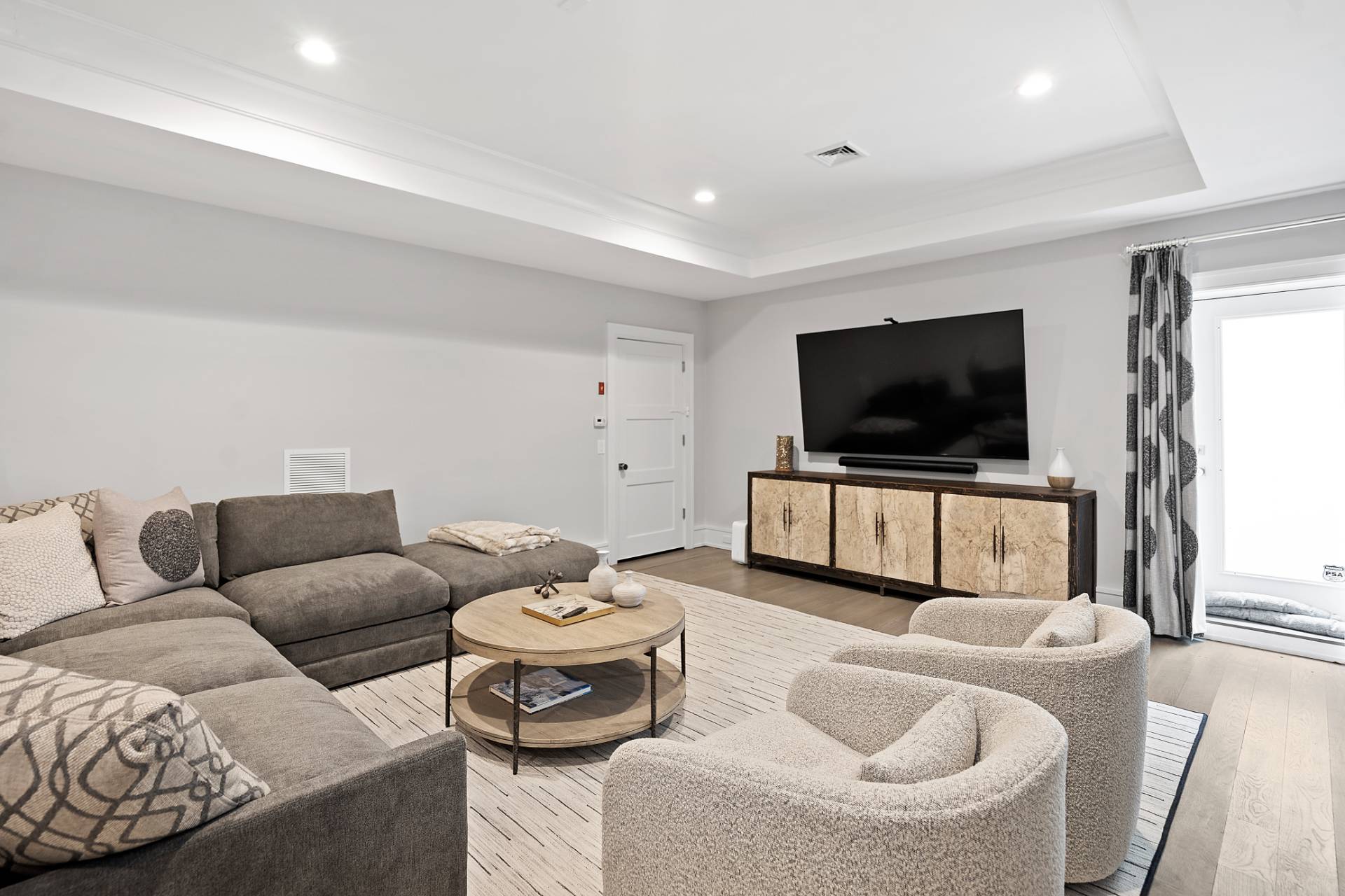 135 Hildreth Lane Bridgehampton, NY 11932 - Photo 32 of 38 a living room with furniture and a flat screen tv