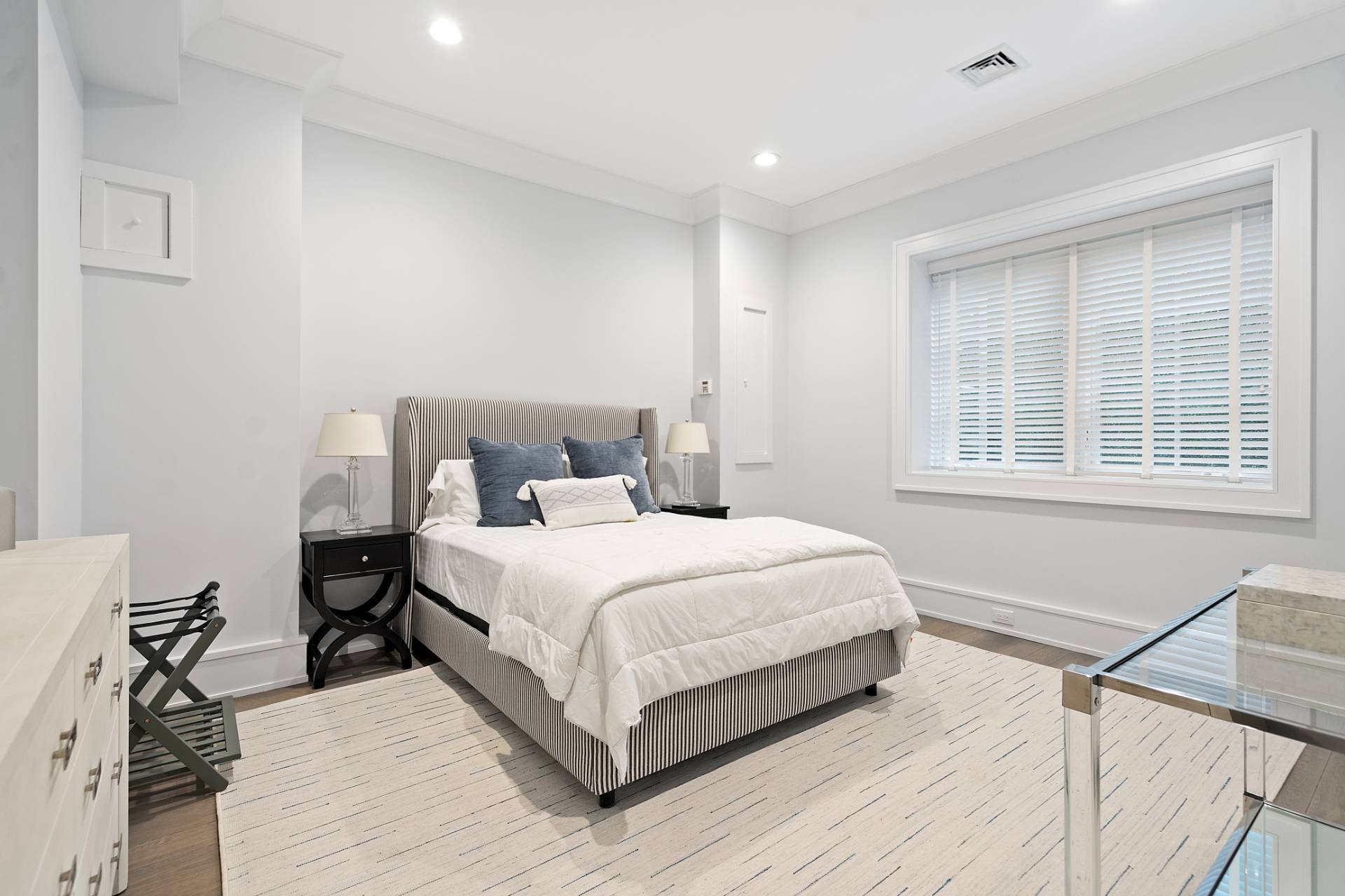 135 Hildreth Lane Bridgehampton, NY 11932 - Photo 33 of 38 a bedroom with a bed and wooden floor