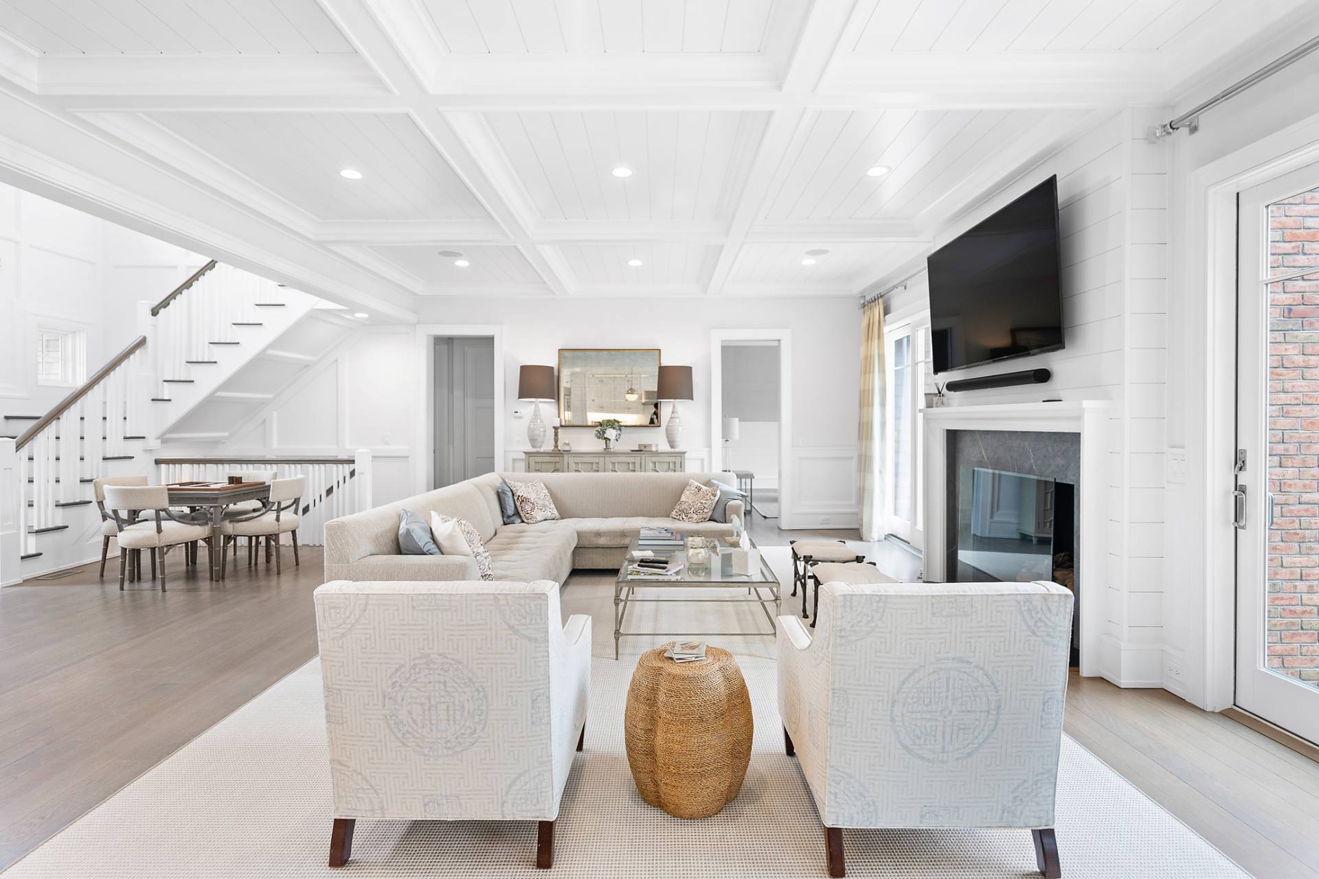 135 Hildreth Lane Bridgehampton, NY 11932 - Photo 7 of 38 a living room with furniture a flat screen tv and a fireplace