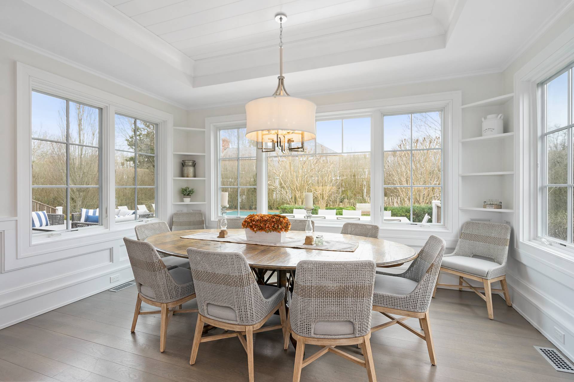 135 Hildreth Lane Bridgehampton, NY 11932 - Photo 10 of 38 a dining room with furniture a chandelier and wooden floor