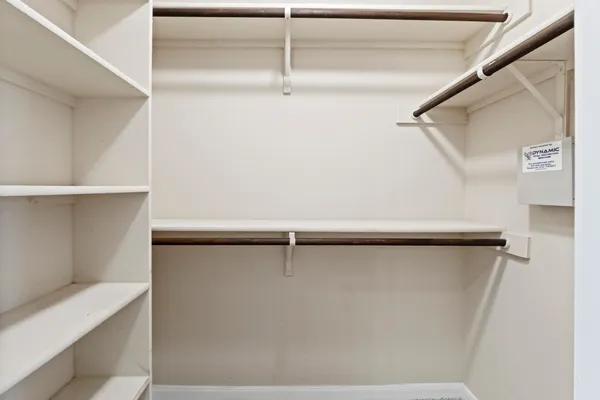 a bathroom with a double vanity sink toilet mirror and bathtub