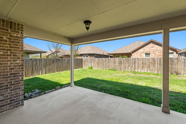 a view of a house with basketball court