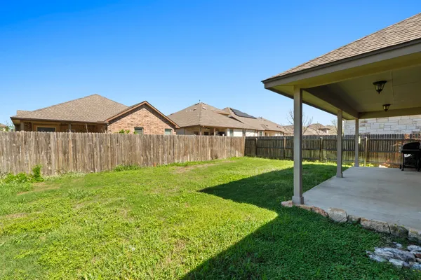 a view of backyard with outdoor space