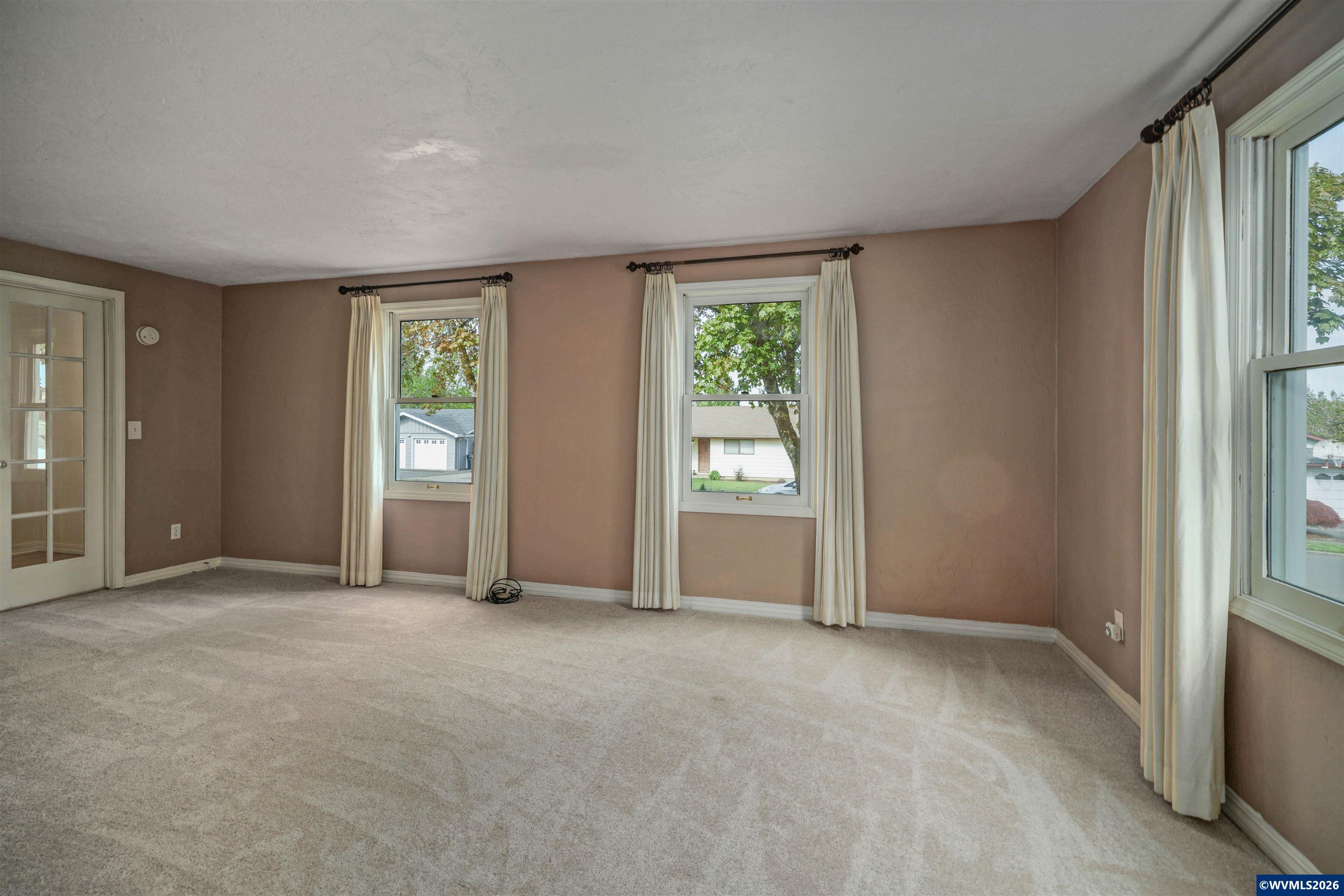 220 Northwest Downy Drive Sublimity, OR 97385 - Photo 15 of 47 an empty room with windows and closet