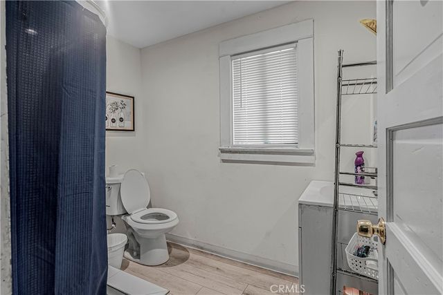 a bathroom with a toilet and a sink