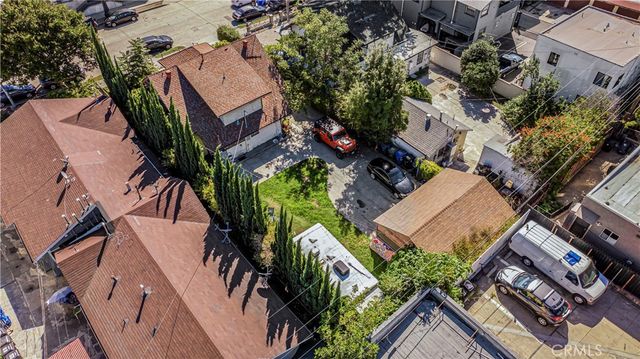 an aerial view of a house with a yard