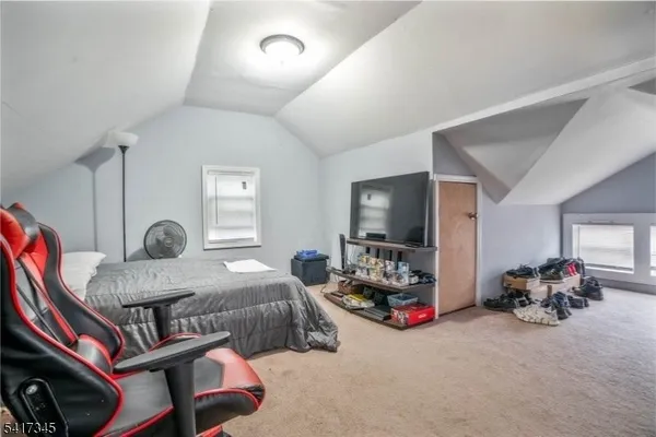 a bed room with furniture and a window