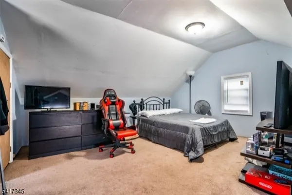 a bedroom with bed and window
