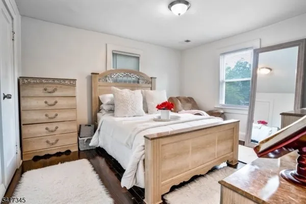 a bed room with a bed and a window