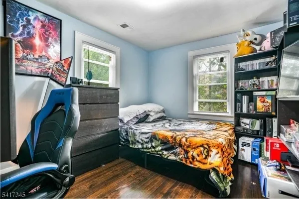 a bedroom with bed and a window